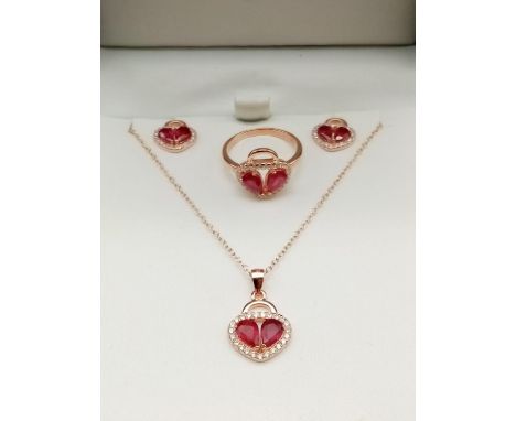 Rose gold sterling silver ruby ring with matching pendant and earrings in presentation box. Ring size J. 