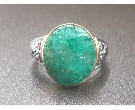 10ct emerald ring with rose cut diamonds, two tone finish, the emerald has been set in 9kt yellow gold on the top, rest of th