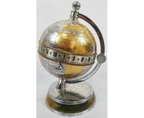 A Mappin and Webb Greenwich Meridian Globe Clock Timepiece. Silver Plate and gilt decoration on an Onyx and plated circular b