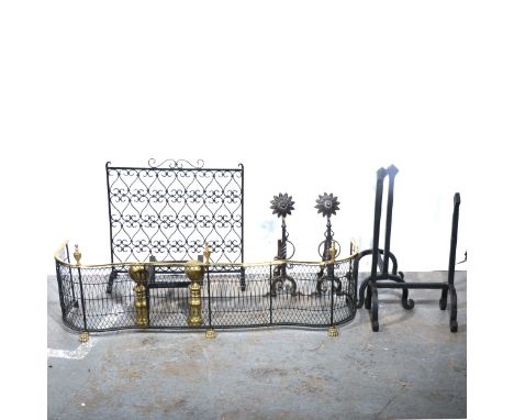 A brass and wire fender, two pairs of fire dogs, wrought iron screen, and a fire basket stand, fender width 125cm.