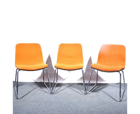 Three vintage chairs, circa 1975, orange woollen upholstered seat shells raised on chrome tubular bases, height 77cm.