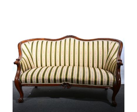 A Victorian walnut framed sofa, shaped carved back, striped upholstery, width158cm, depth 71cm, height 85cm.Catalogue amendme