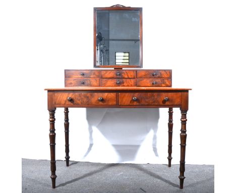 A Victorian mahogany dressing table, adapted, with a mirror over, fitted with six trinket drawers over two frieze drawers, tu