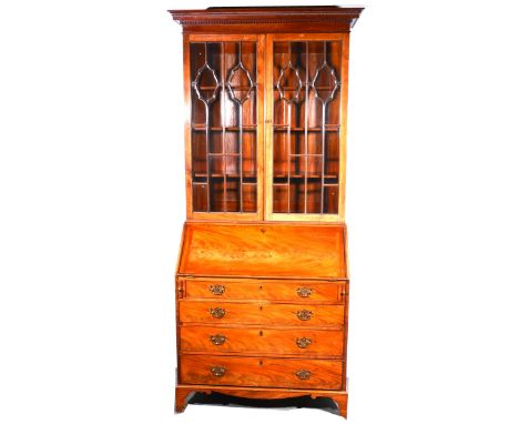 A George III mahogany bureau bookcase, glazed upper section enclosing shelves, the base with a fallfront writing surface, enc
