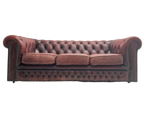Chesterfield three-seat sofa upholstered in red buttoned leatherDimensions: Height:&nbsp;66cm&nbsp; Length/Width:&nbsp;187cm&