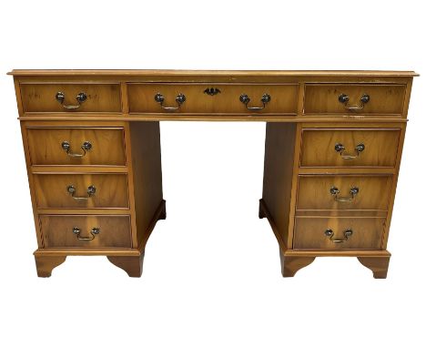 Georgian design yew wood twin pedestal desk, moulded rectangular top over nine cock-beaded drawers, on bracket feetDimensions