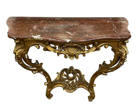 19th century giltwood and gesso console table, shaped variegated rouge marble top with moulded edge, central shell motif with