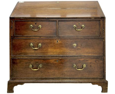 Late 18th century oak bureau, fall front enclosing pigeonholes, cupboard and drawers, fitted with two short and two long cock