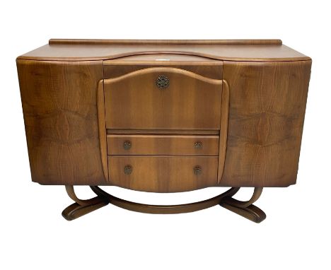 Beautility - mid-20th century walnut sideboard, fall-front with sliding top enclosing mirror interior, fitted with two drawer