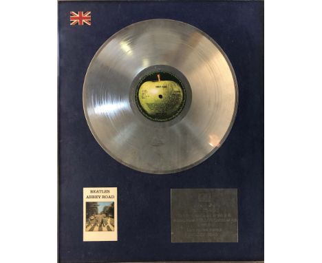 JOHN LENNON THE BEATLES ABBEY ROAD PLATINUM DISC INC SIGNED CHRIS FARLOWE COA. A mounted and framed presentation disc with pl