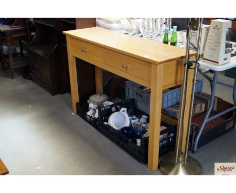 A modern light oak hall fitted two drawers