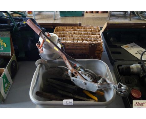 A hand winch; various tools; a small milking churn and a picnic basket etc