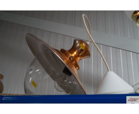 A copper effect hanging ceiling light