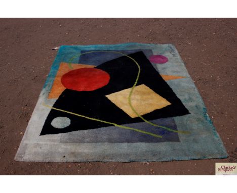 An approx. 6'9" x 5' geometric patterned rug, signed M Temple AF