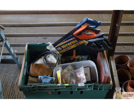 A box containing various tools to include a mini vac pump and saws etc.