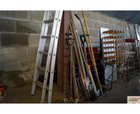 A quantity of long handled gardening tools
