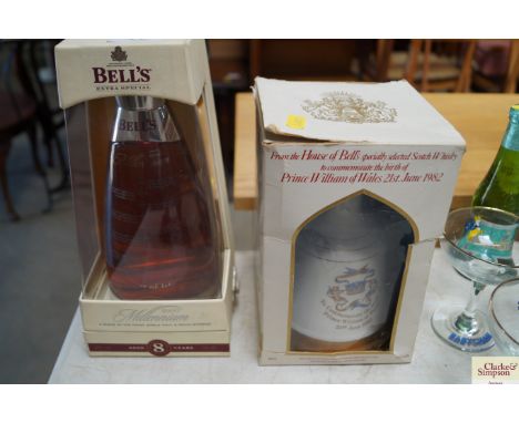 A Wade Bells scotch whiskey decanter and contents and a bottle of Bells Millennium whiskey