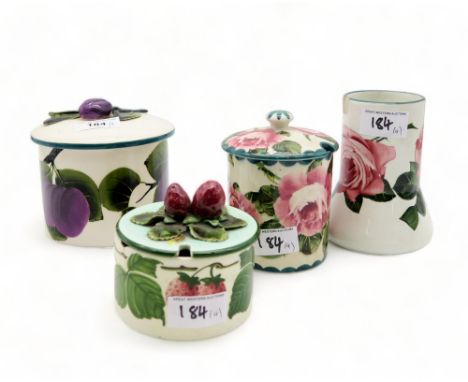 A Griselda Hill plum pot, a Wemyss cabbage rose preserve pot and vase, together with a strawberry pot in the style of Wemyss 