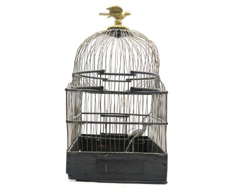 An architectural stained wood and wire work bird cage, with finial formed as a dove, measuring approx. 56cm in overall height
