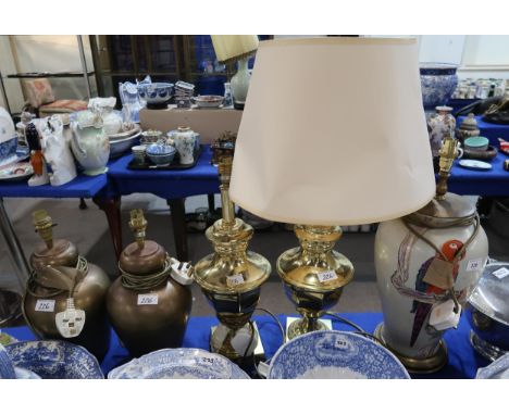 A pottery table lamp decorated with a parrot, and two pairs of table lamps Condition Report:Available upon request