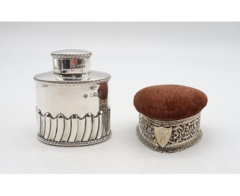 A late-Victorian silver tea caddy, by William Hutton &amp; Co, London 1898, of oval form, the body half fluted, engraved with