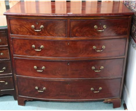 An early 20th century mahogany bow front two over three chest of drawers on bracket feet, 98cm high x 109cm wide x 56cm deep 