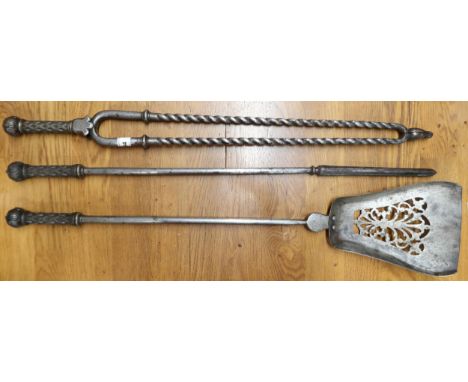 A 19th century set of three fire tools comprising poker, tong and shovel with decorated handles (3)&nbsp; Condition Report:Av