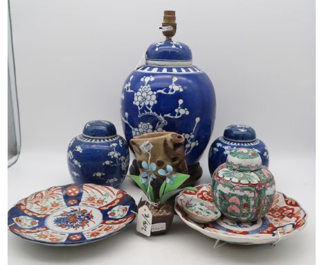 A large Chinese blue and white prunus pattern ginger jar lamp, a matched pair of blue and white ginger jars (matched lids), 1