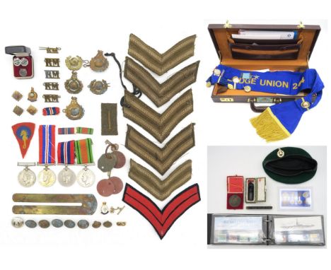 WW2 War and Defence medals, a 104th Royal Marines Training Brigade cloth formation patch, assorted buttons, cap badges, dog t