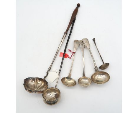 A collection of silver and white metal flatware, including a Georgian white metal ladle, inset with a George II coin, another