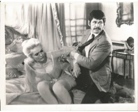 Charles Bronson signed 10 x 8 inch b/w portrait photo. Signed in darker area and slight creasing. Condition 5/10. All autogra