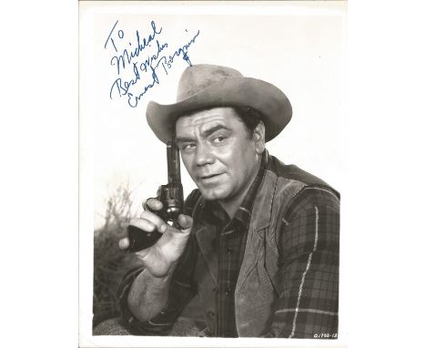 Ernest Borgnine signed 10 x 8 inch b/w portrait photo, to Michael. Young image western movie outfit. Condition 8/10. All auto