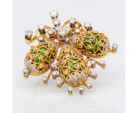 An 18K gold diamond spray broochSet with three enamel decorated eggs.  4.5 cm high.  CONDITION REPORTS: Generally in good con