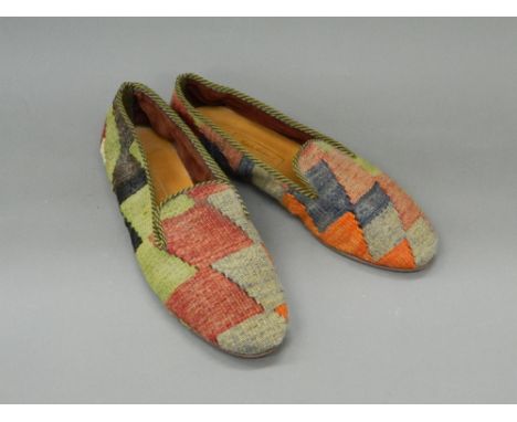 A  pair of carpet slippersWith leather soles, a label to the interior A T Nicholas Haslam LONDON. Size 10.5.  Provenance:  Th