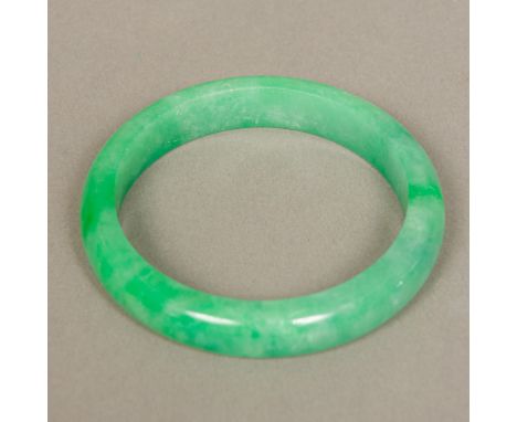 A Chinese carved jade bangle8 cm diameter.  CONDITION REPORTS: Generally good with expected wear. 