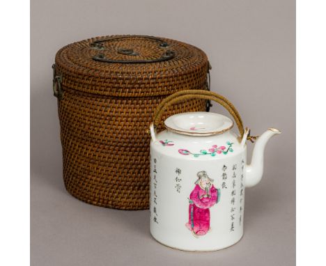 A 19th century Chinese famille rose porcelain teapot Decorated in the round with figures amongst calligraphy, housed in origi