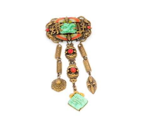 A late 19th/early 20th century Chinese broochOf triple drop form, set with jade and carvings and coral cabochons.  10.5 cm hi
