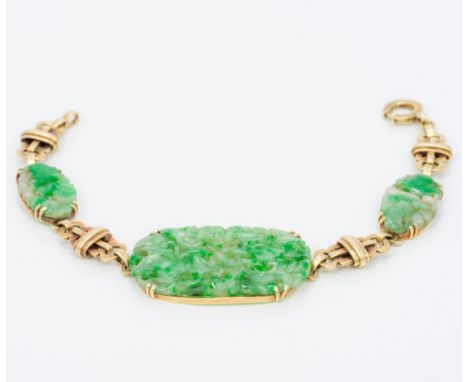 A Chinese unmarked gold and jade braceletSet with three pierced jade panels.  18 cm long.  CONDITION REPORTS: Generally in go