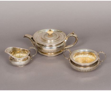 A George III/George IV matched four piece silver tea set, teapot hallmarked London 1818, maker's mark of WE, stand hallmarked