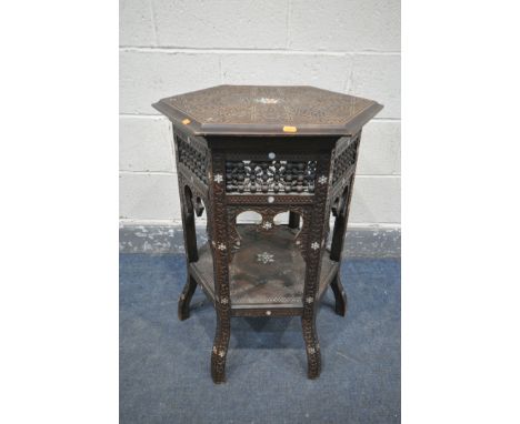 A LATE 19TH CENTURY HEXAGONAL MOORISH TABLE, blind fretwork carving throughout and inlaid with mother of pearl, 52cm diameter