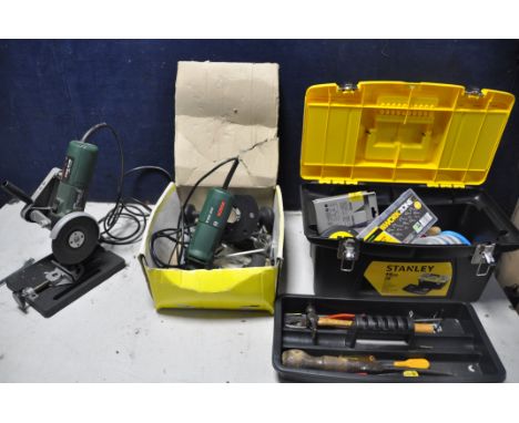 A BOSCH PWS5-115 ANGLE GRINDER with clamp stand, Bosch POF500A router in original box with attachments and a Stanley toolbox 