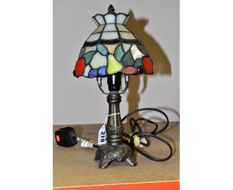 A SMALL TIFFANY STYLE TABLE LAMP, the glass shade is decorated with red apples and yellow pears, height 32cm to top of finial