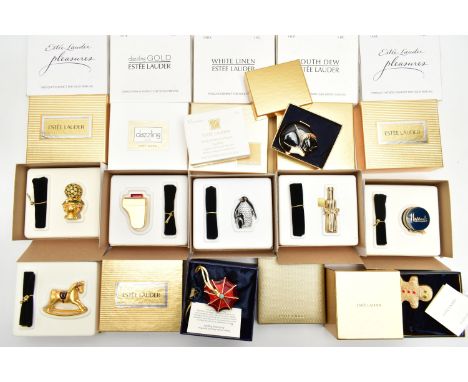 A SELECTION OF EIGHT BOXED COLLECTABLE ESTEE LAUDER SOLD PERFUME BOXES AND ONE BOXED ESTEE LAUDEE COMPACT, the soild perfumes