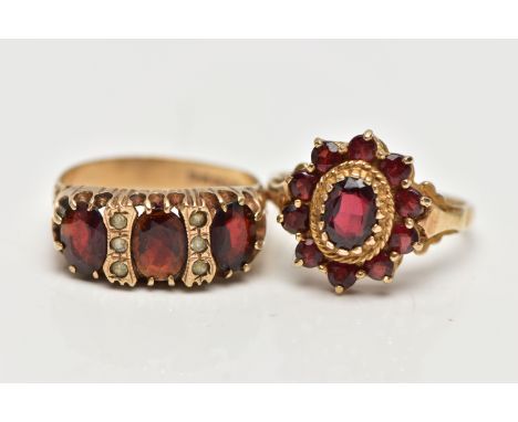 TWO 9CT GOLD GARNET RINGS, to included a garnet three stone ring set with three oval cut garnets, interspaced by colourless p