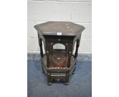 A LATE 19TH CENTURY HEXAGONAL MOORISH TABLE, blind fretwork carving throughout, and inlaid with mother of pearl, 44cm x heigh