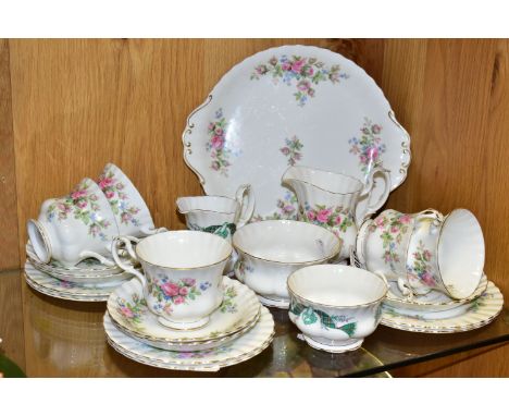 A ROYAL ALBERT 'MOSS ROSE' PATTERN TEA SET TOGETHER WITH A ROYAL ALBERT 'CAPE BRETON ISLAND' PATTERN SUGAR BOWL AND CREAM JUG