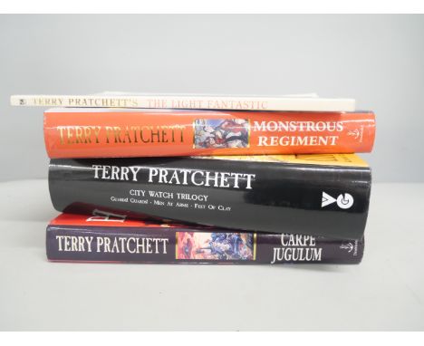 Three first edition hardback books by Terry Pratchett 'Carpe Jugulum', 'Monstrous Regiment', 'City Watch Trilogy' and 'The Li