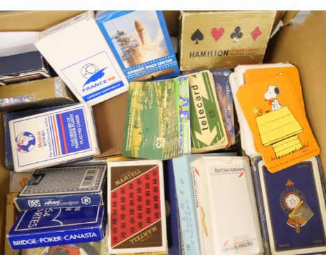 A collection of vintage playing cards including British Airways and Sibilla 