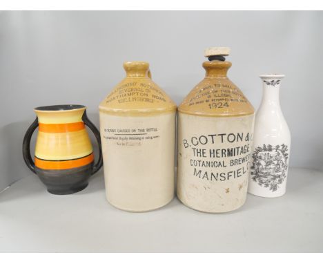 Two stoneware flagons with company names, B Cotton &amp; Co Mansfield and Wellingboro Botanical, with a Coalport carafe and a