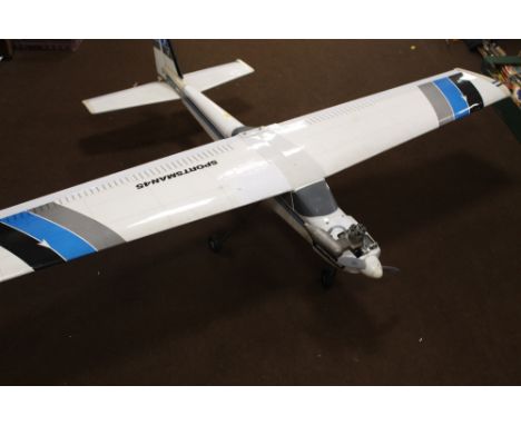 A SPORTSMAN 45 REMOTE CONTROL MODEL AREOPLANE,  with enya engine, original box with spare wing. 